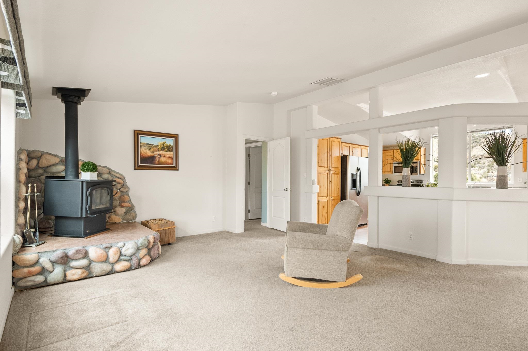 3984 Rapid Creek Road Palisade, CO 81526 - Photo 16 of 30 a bedroom with furniture and a lamp