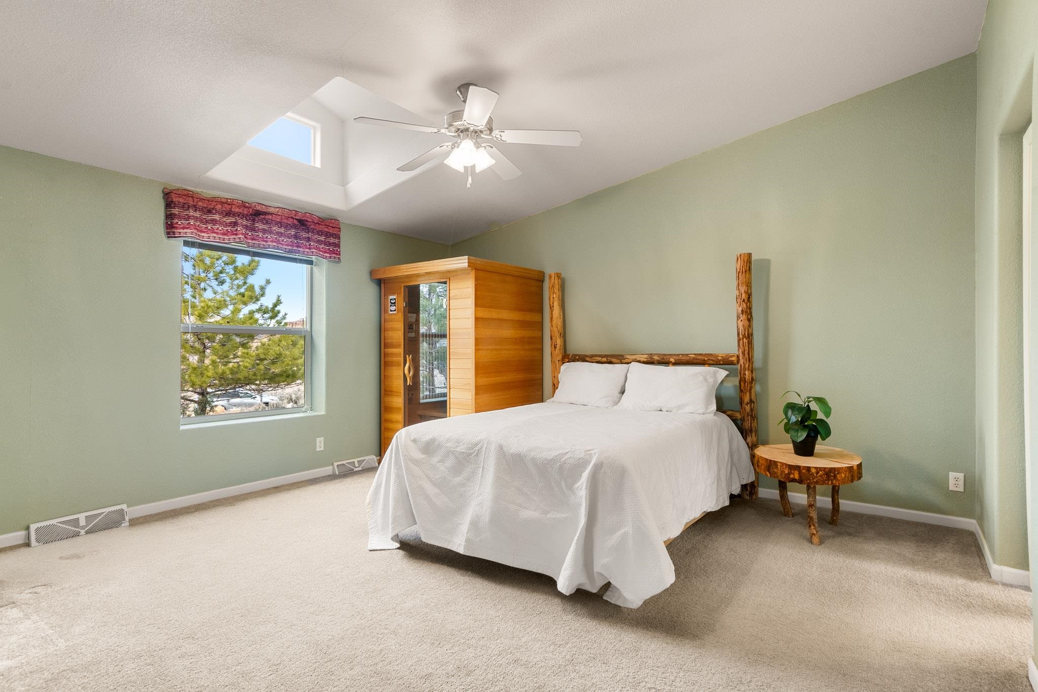 3984 Rapid Creek Road Palisade, CO 81526 - Photo 18 of 30 a bedroom with a bed lamp and window