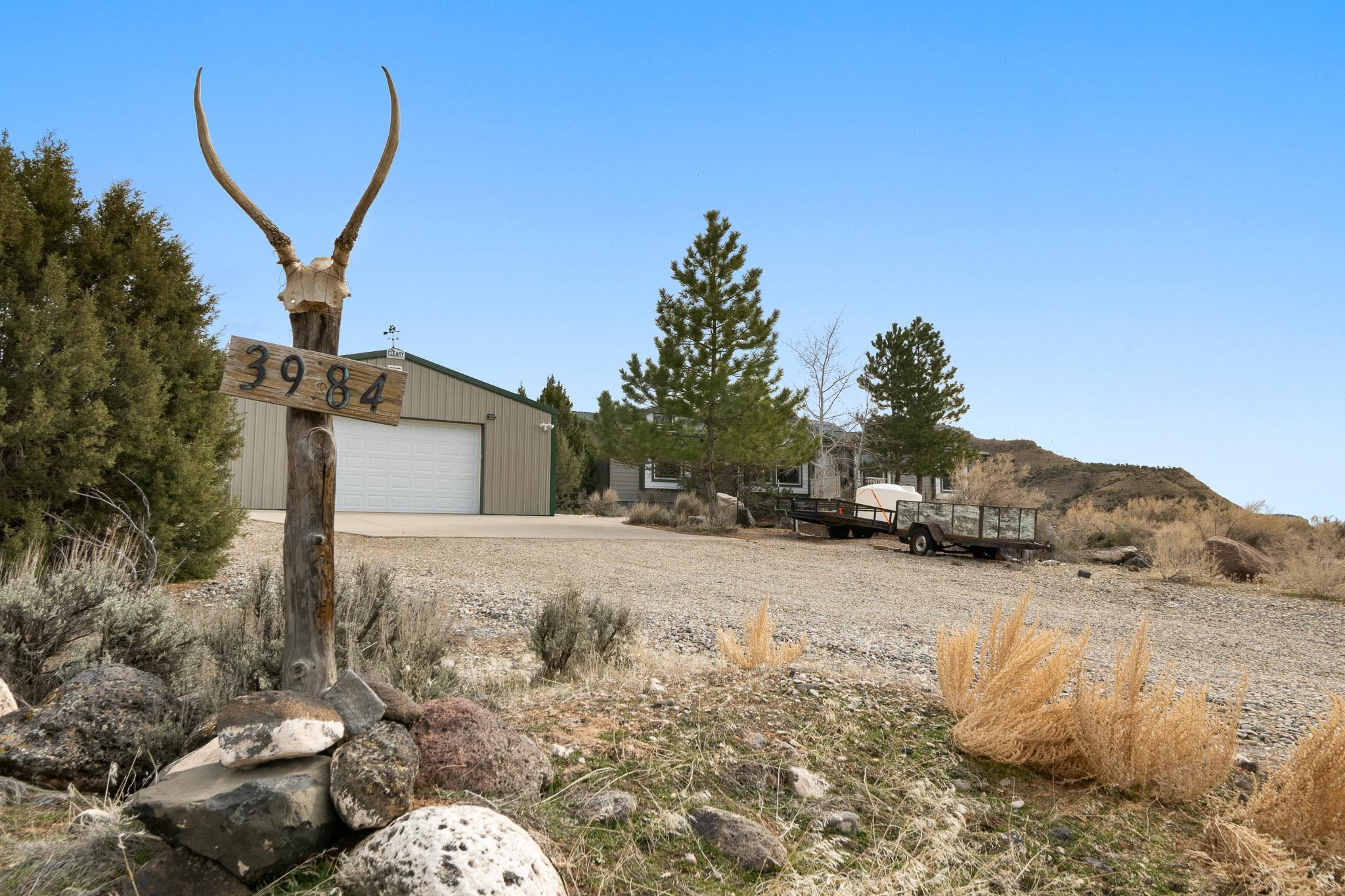 3984 Rapid Creek Road Palisade, CO 81526 - Photo 2 of 30 a backyard of a house with lots of green space