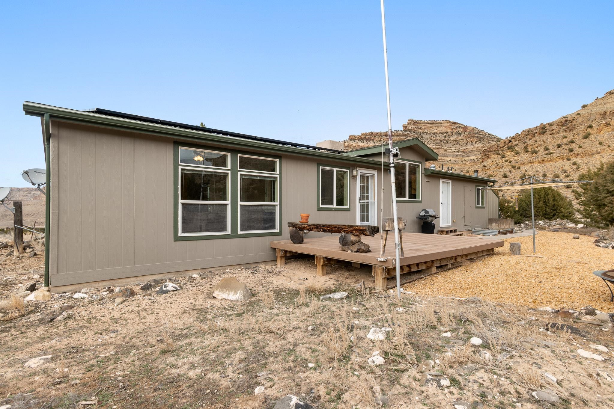 3984 Rapid Creek Road Palisade, CO 81526 - Photo 27 of 30 a view of a house with a patio