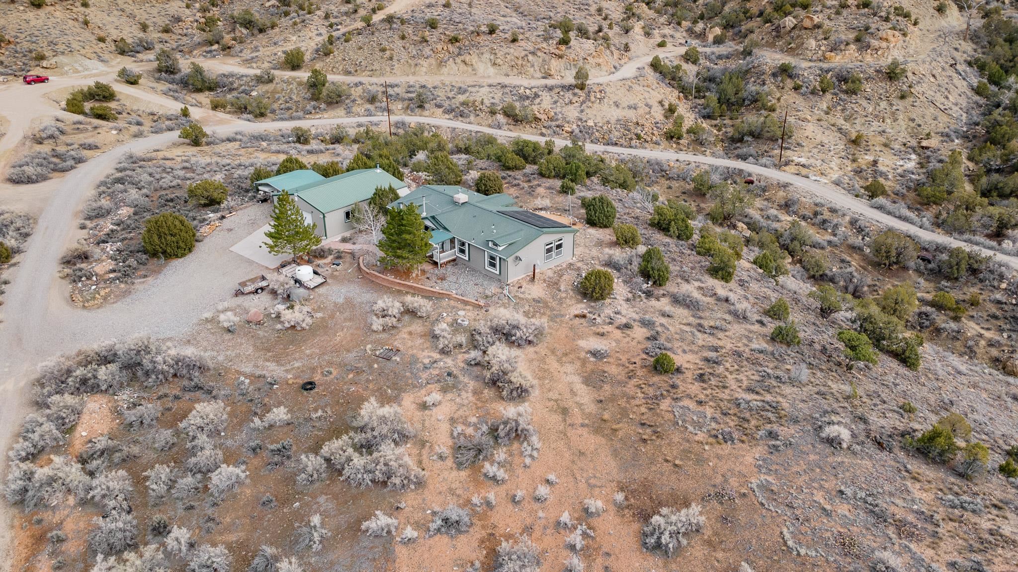 3984 Rapid Creek Road Palisade, CO 81526 - Photo 4 of 30 a view of a dry field with trees in the background