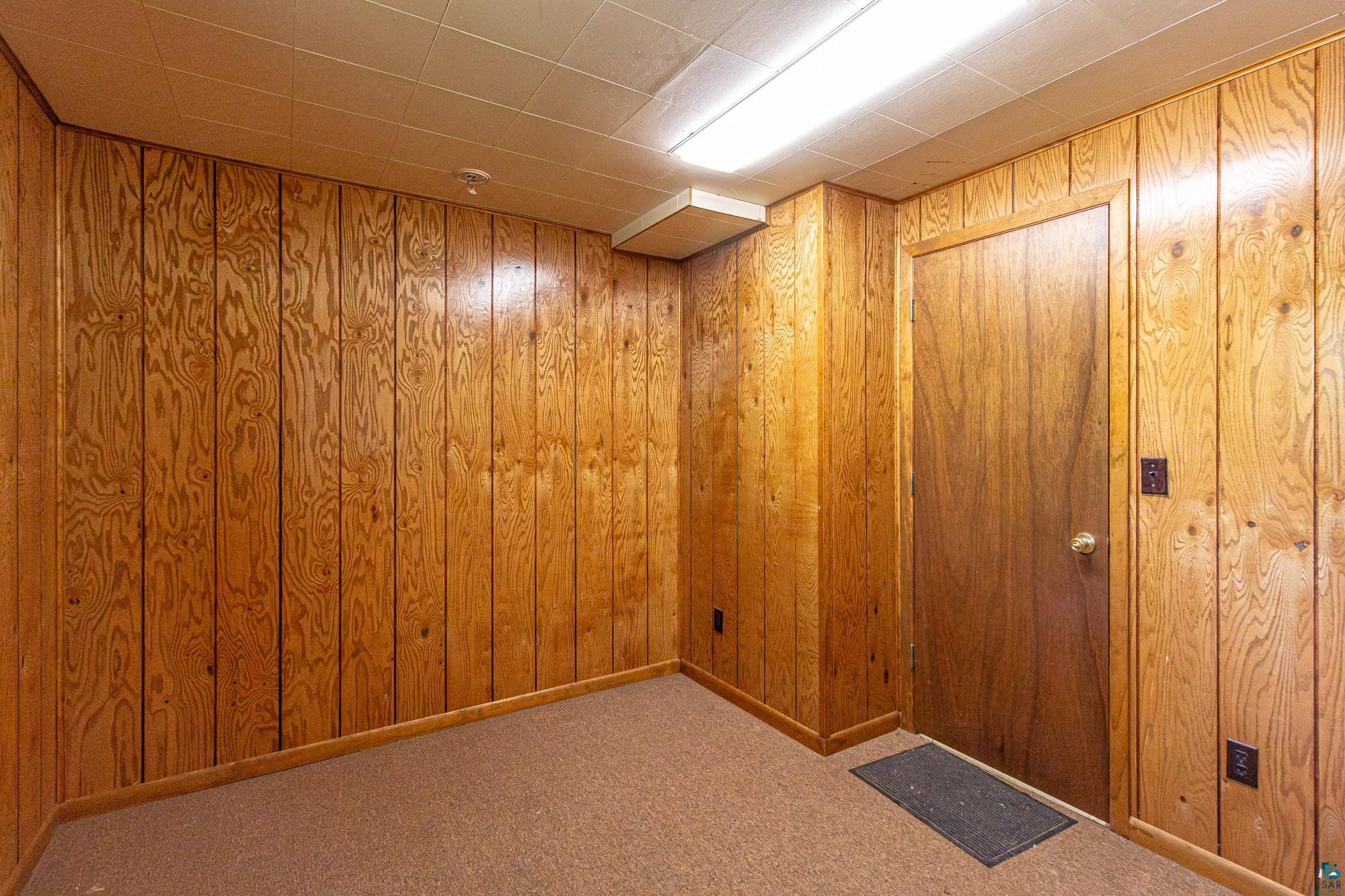 14687 North Country Road Ely, MN 55731 - Photo 24 of 44 Office featuring carpet floors and wood walls