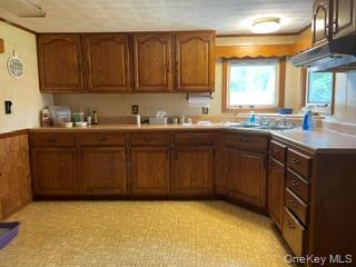 100 Decker Road, Unit 2 Wallkill, NY 12589 - Photo 13 of 23 a kitchen with a sink a stove and cabinets