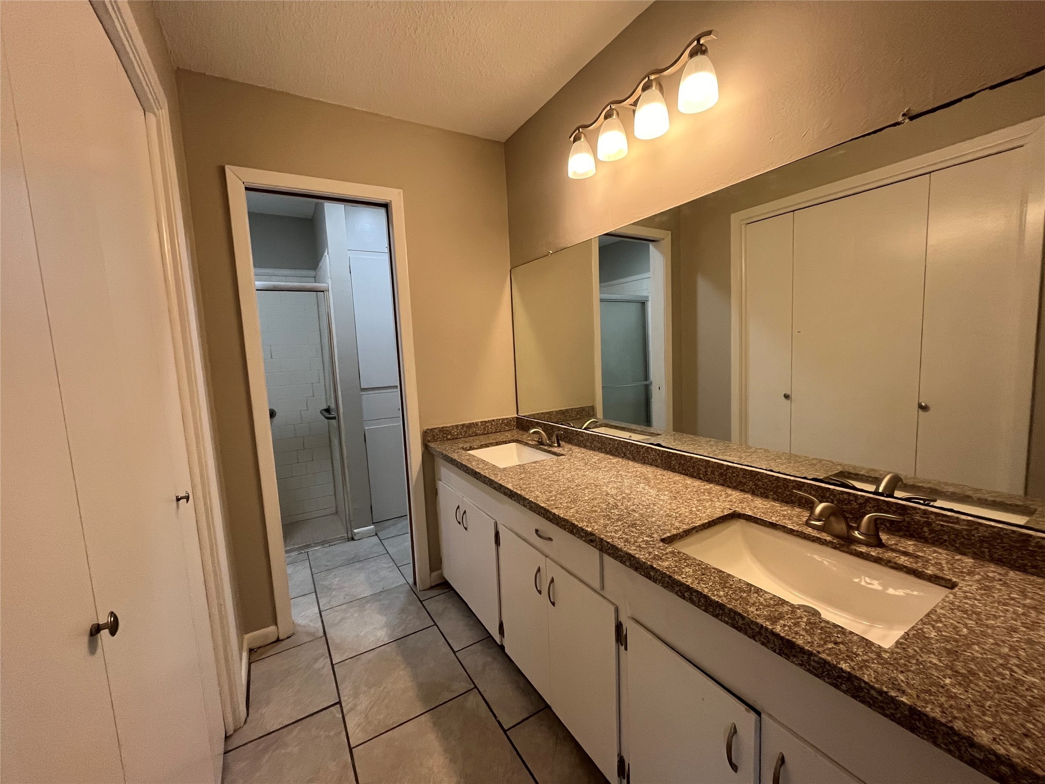 3924 Wickersham Street Bay City, TX 77414 - Photo 15 of 20 a bathroom with a granite countertop sink and a mirror