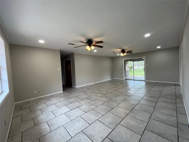 a view of an empty room and a window
