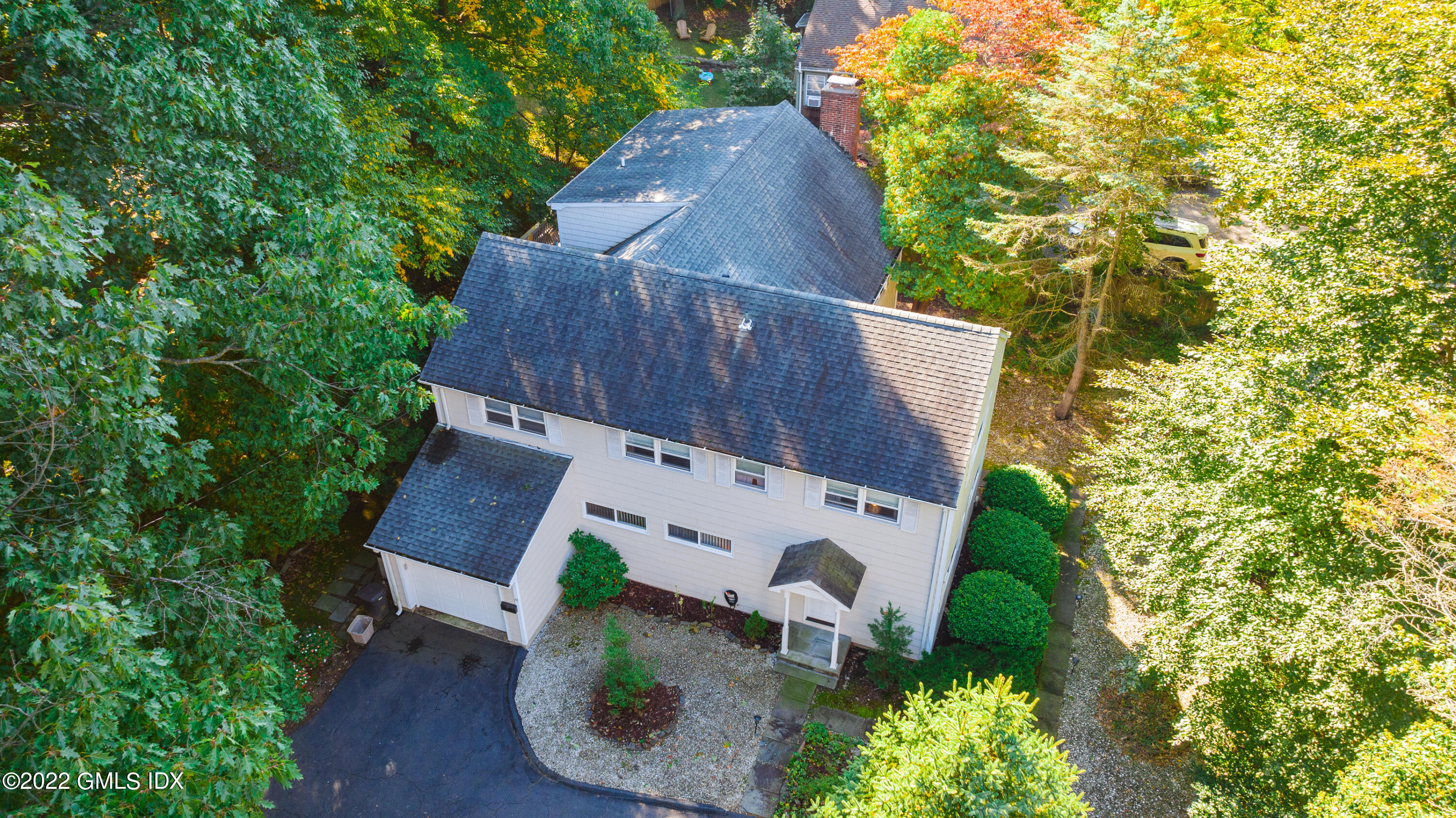 65 Laddins Rock Road Old Greenwich, CT 06870 - Photo 1 of 40 an aerial view of a house with garden space and sitting area