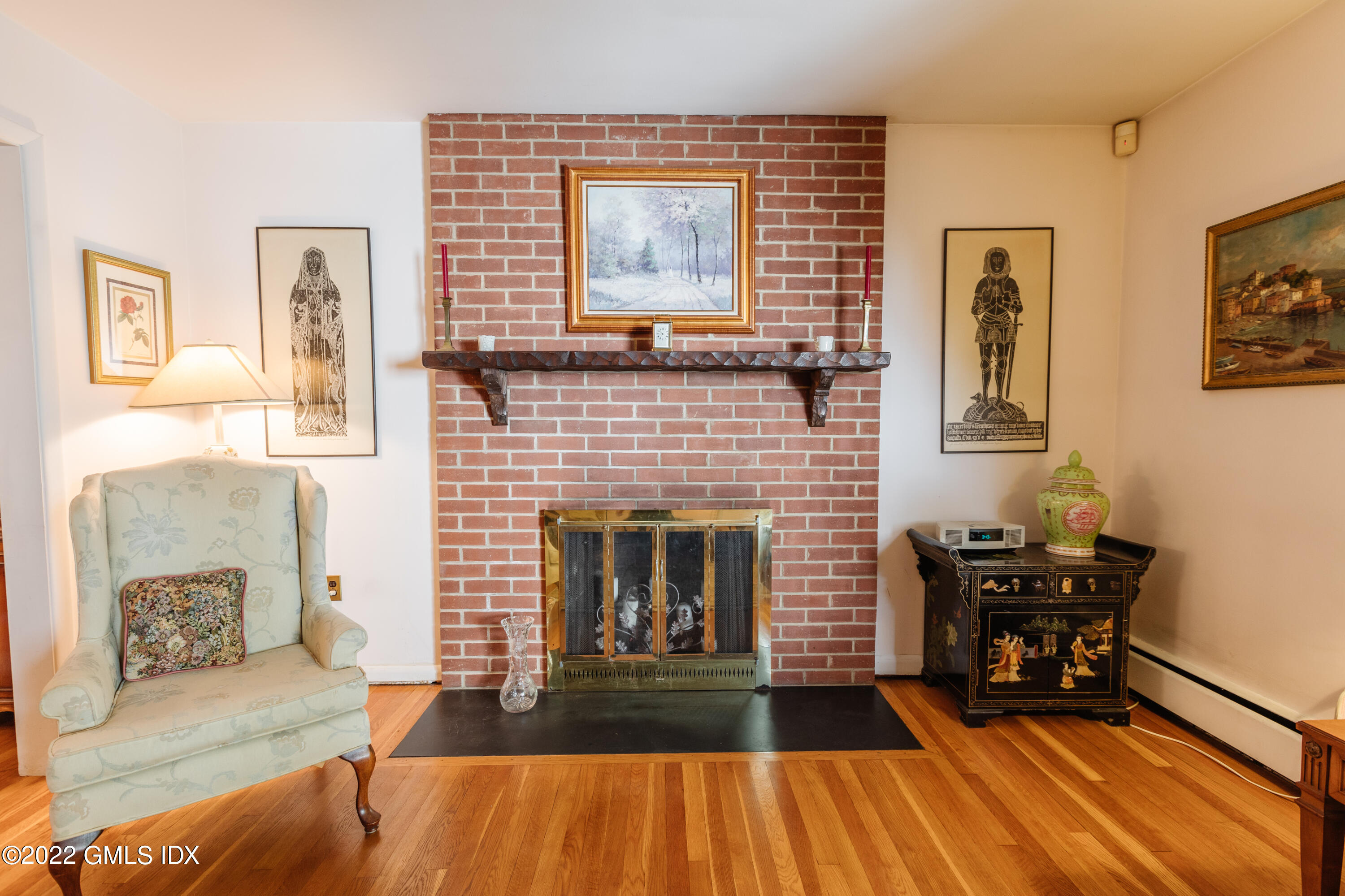 65 Laddins Rock Road Old Greenwich, CT 06870 - Photo 13 of 40 a living room with furniture and wooden floor