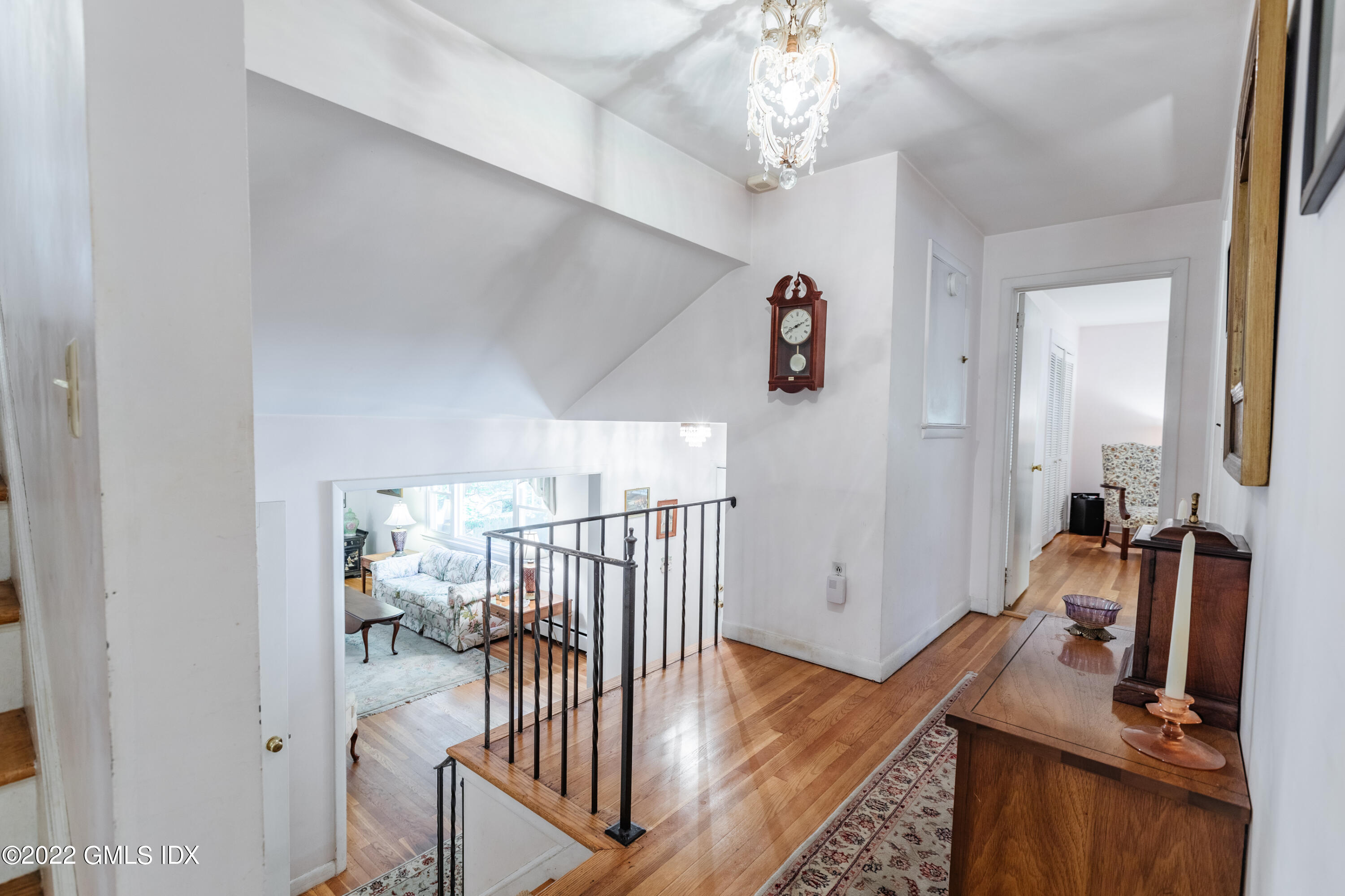65 Laddins Rock Road Old Greenwich, CT 06870 - Photo 15 of 40 a view of a hallway with workspace and wooden floor