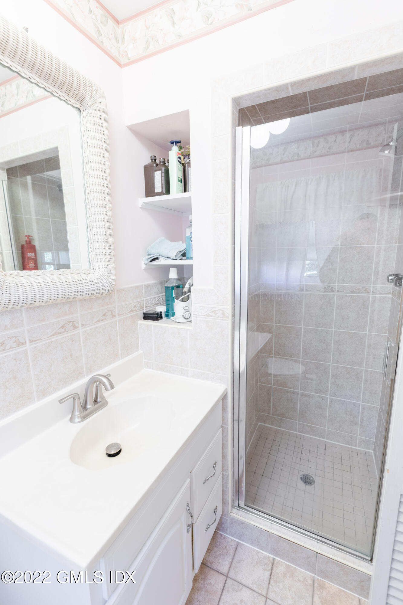 65 Laddins Rock Road Old Greenwich, CT 06870 - Photo 18 of 40 a bathroom with a tub a sink and shower