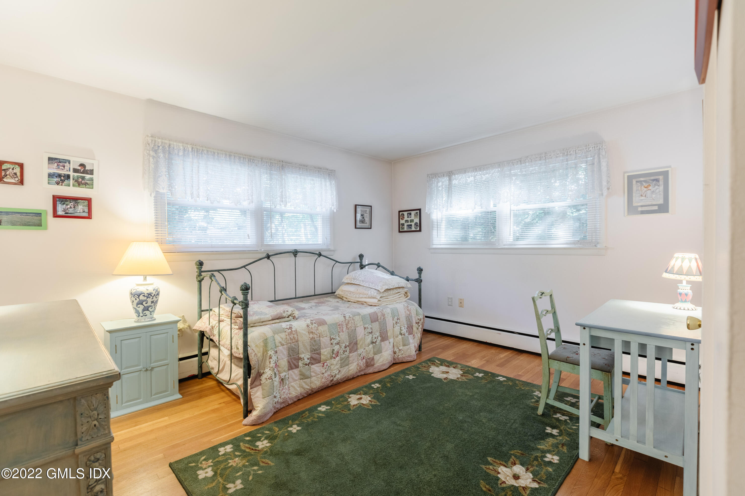 65 Laddins Rock Road Old Greenwich, CT 06870 - Photo 20 of 40 a bedroom with a bed and window