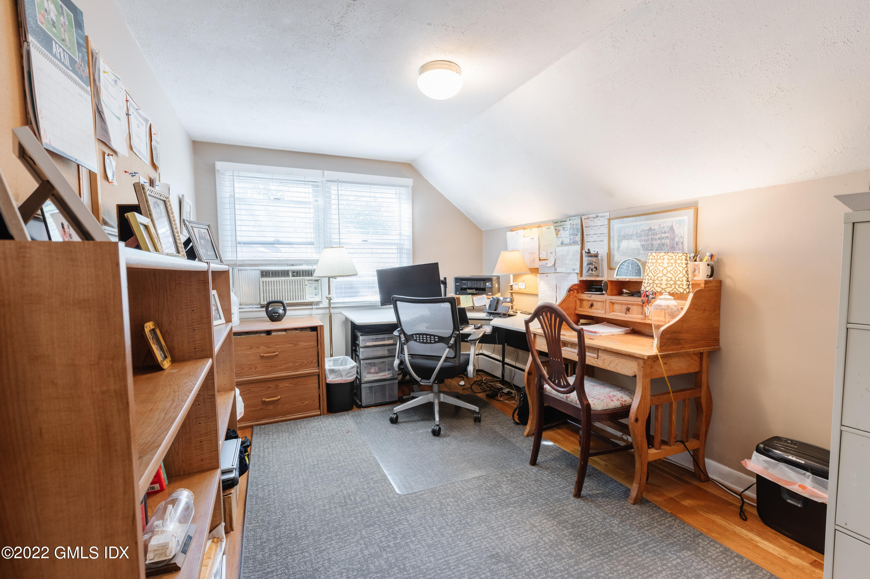 65 Laddins Rock Road Old Greenwich, CT 06870 - Photo 24 of 40 a room with furniture a air conditioner vent and a window