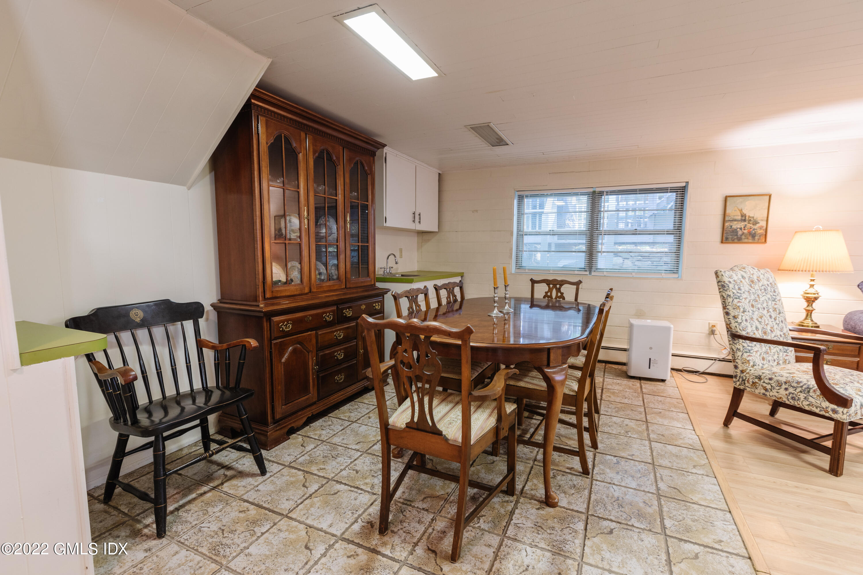 65 Laddins Rock Road Old Greenwich, CT 06870 - Photo 31 of 40 a view of a dining room with furniture