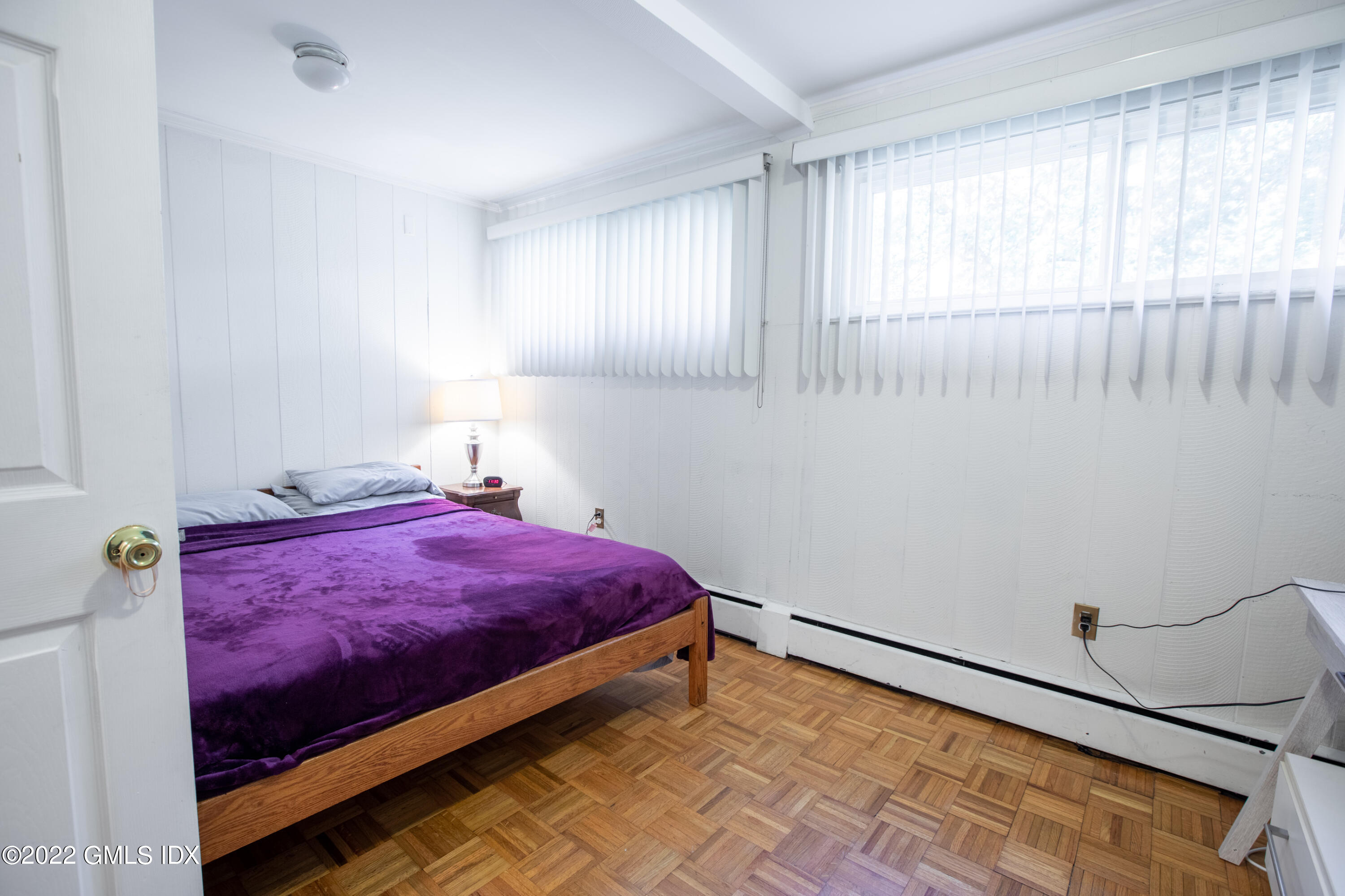 65 Laddins Rock Road Old Greenwich, CT 06870 - Photo 32 of 40 a bedroom with a bed and a window