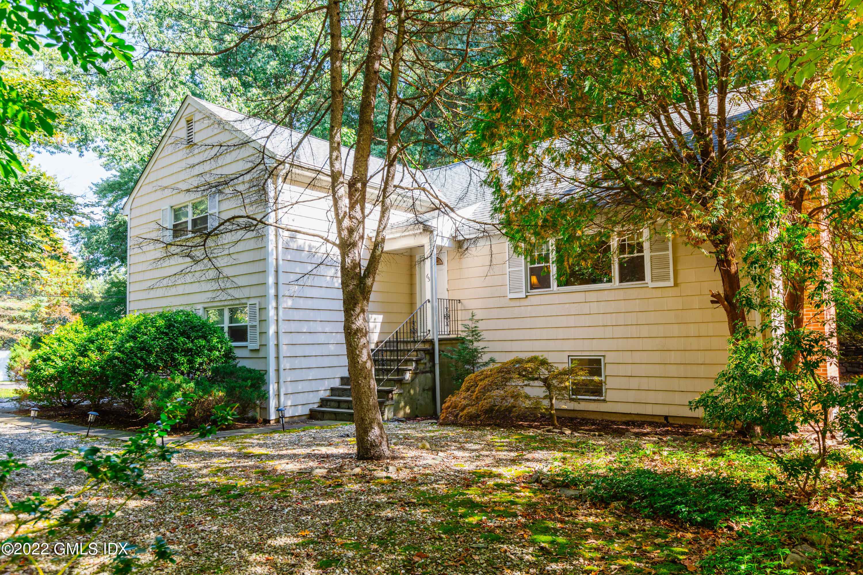 65 Laddins Rock Road Old Greenwich, CT 06870 - Photo 39 of 40 a view of a house with a yard