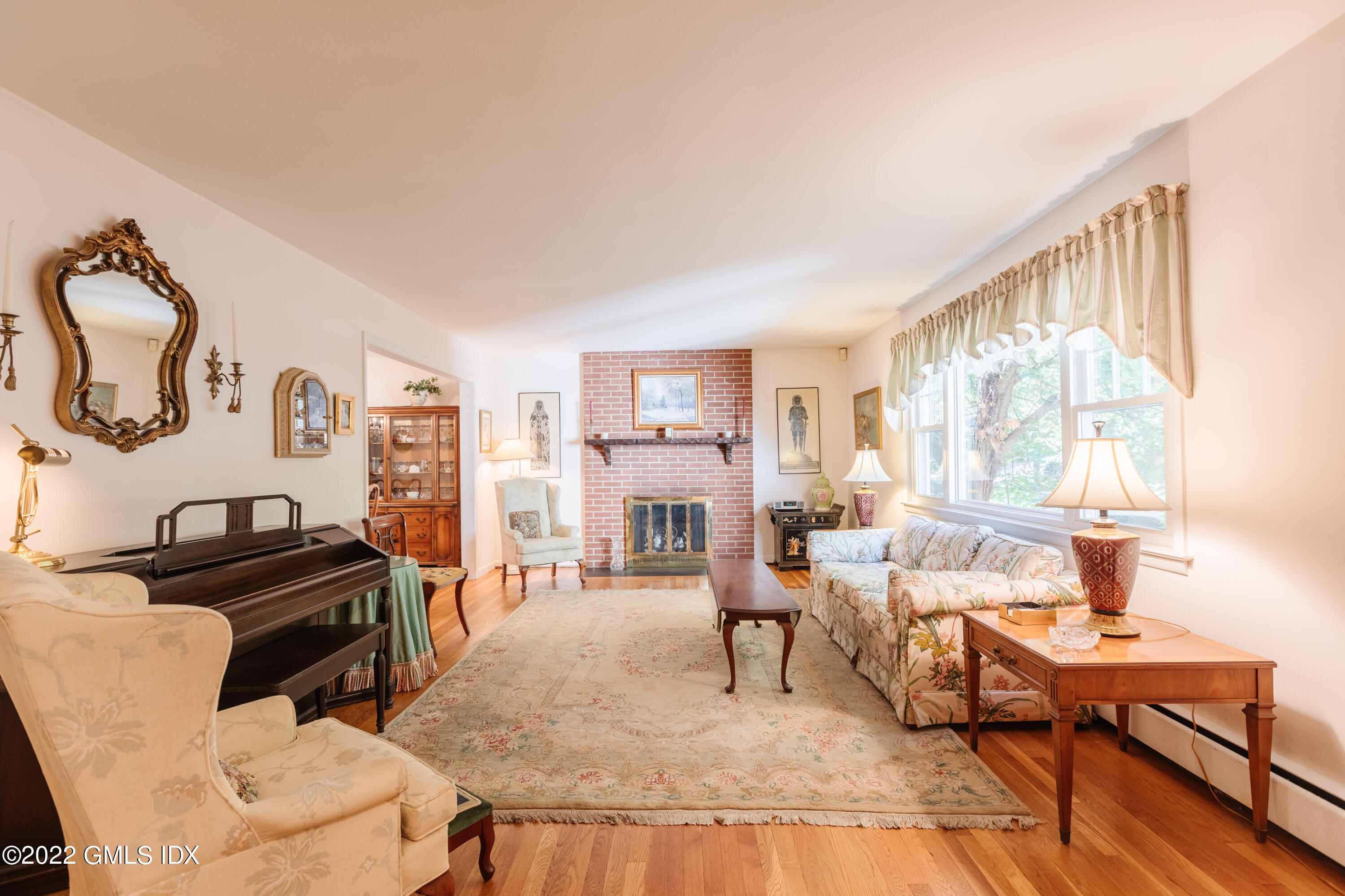65 Laddins Rock Road Old Greenwich, CT 06870 - Photo 5 of 40 a living room with furniture a rug and a window