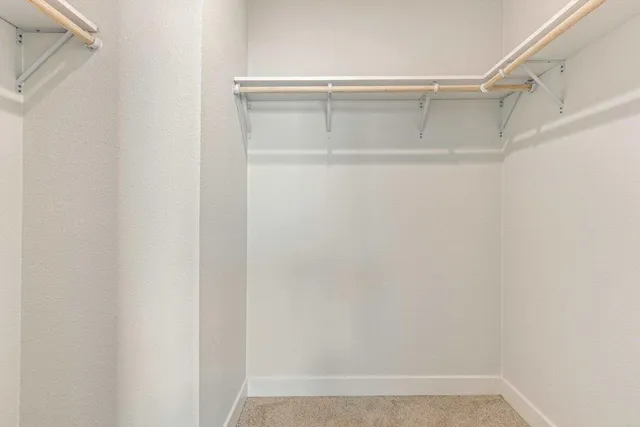 a view of an empty walk in closet
