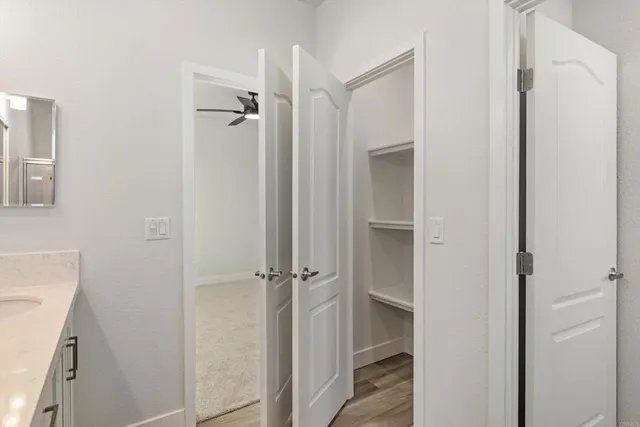 a bathroom with a shower and a sink