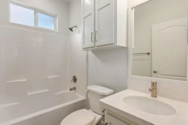 a bathroom with a sink toilet and bathtub