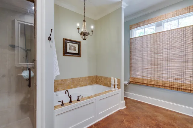 a bathroom with a tub and shower
