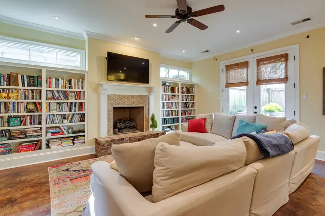 a living room with furniture and a fireplace