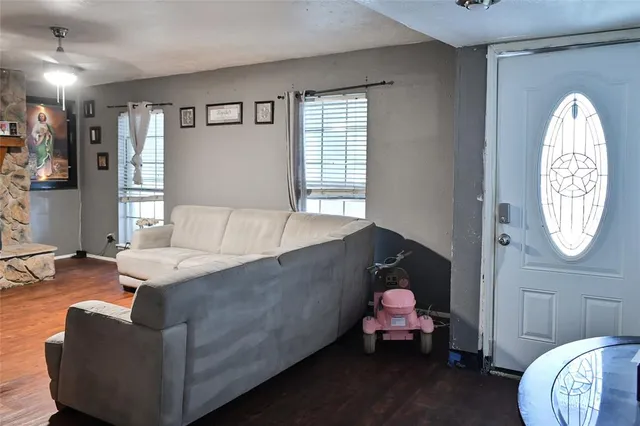 a living room with furniture and a large window
