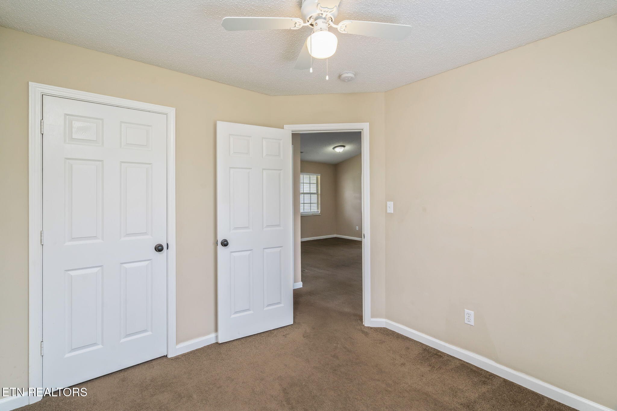 7536 Gary White Road Corryton, TN 37721 - Photo 21 of 26 an empty room with chandelier fan