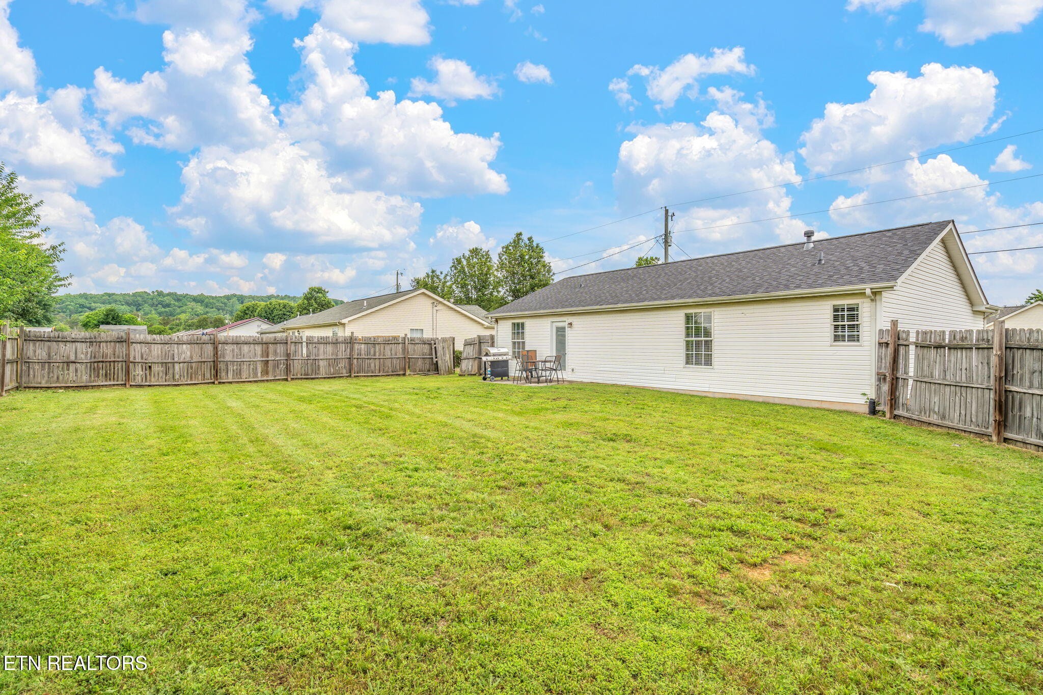 7536 Gary White Road Corryton, TN 37721 - Photo 24 of 26 a house view with swimming pool and trees in the background