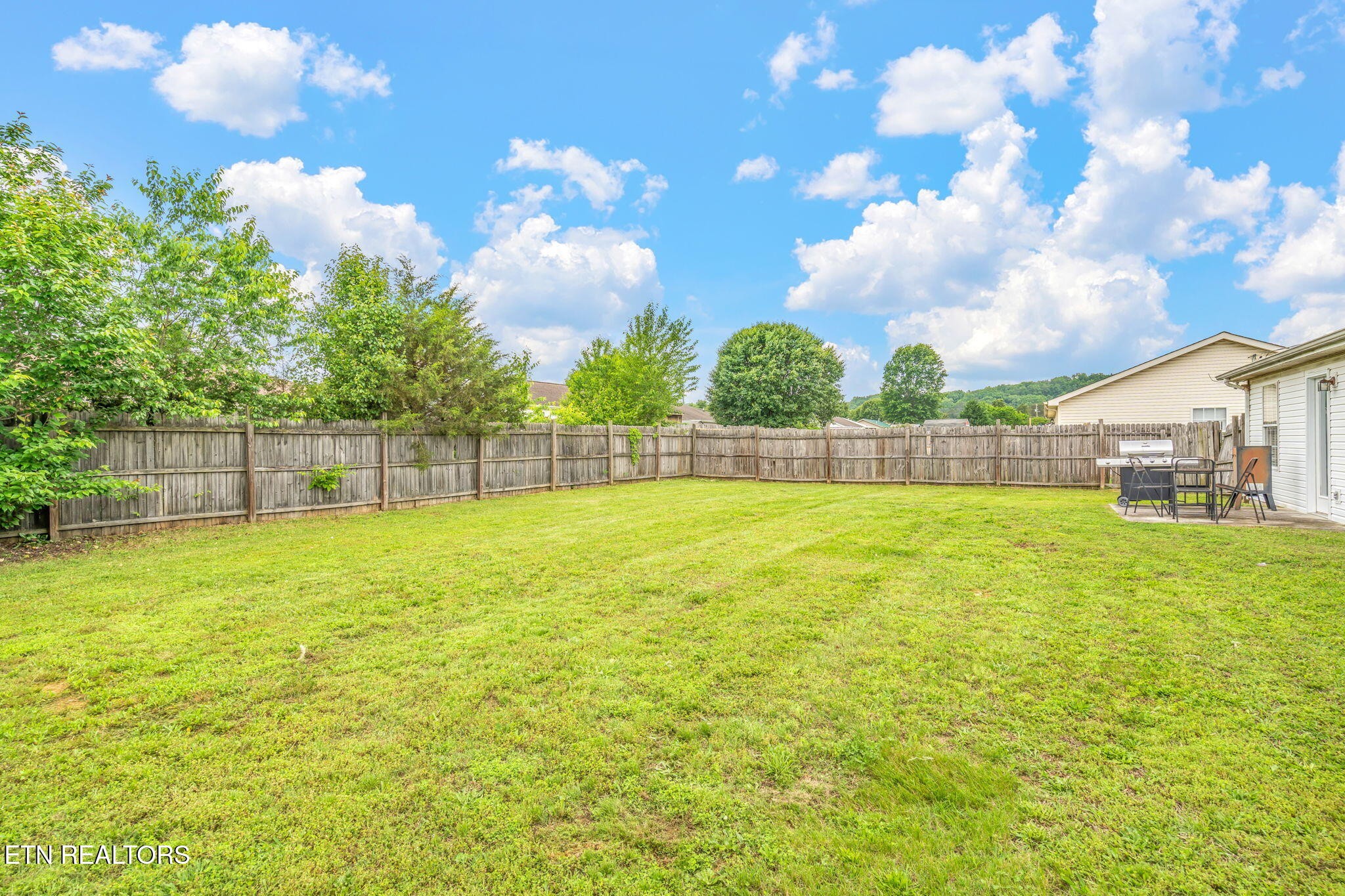 7536 Gary White Road Corryton, TN 37721 - Photo 25 of 26 a view of yard with swimming pool and wooden fence