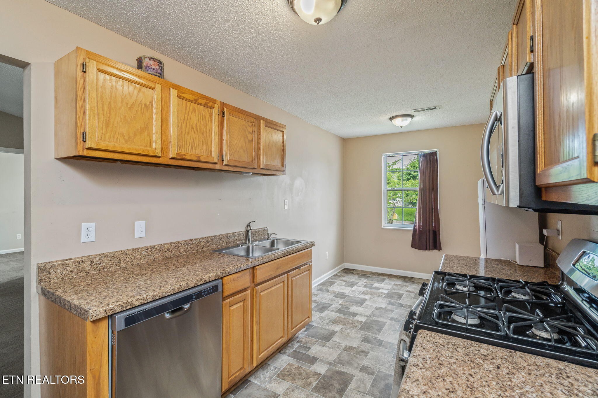 7536 Gary White Road Corryton, TN 37721 - Photo 9 of 26 a kitchen with sink and cabinets