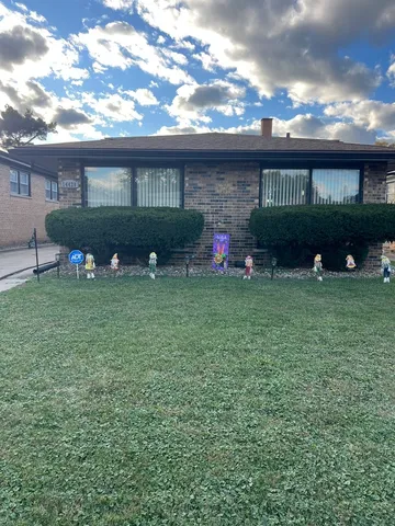 a view of a house with backyard porch and sitting area