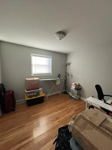 a bedroom with furniture and a window