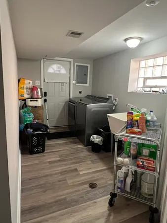 a room with furniture and a wooden floor