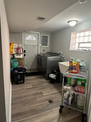 a room with furniture and a wooden floor