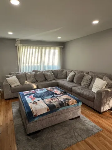 a living room with furniture and window