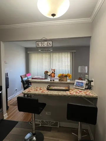 a kitchen with a stove and a refrigerator