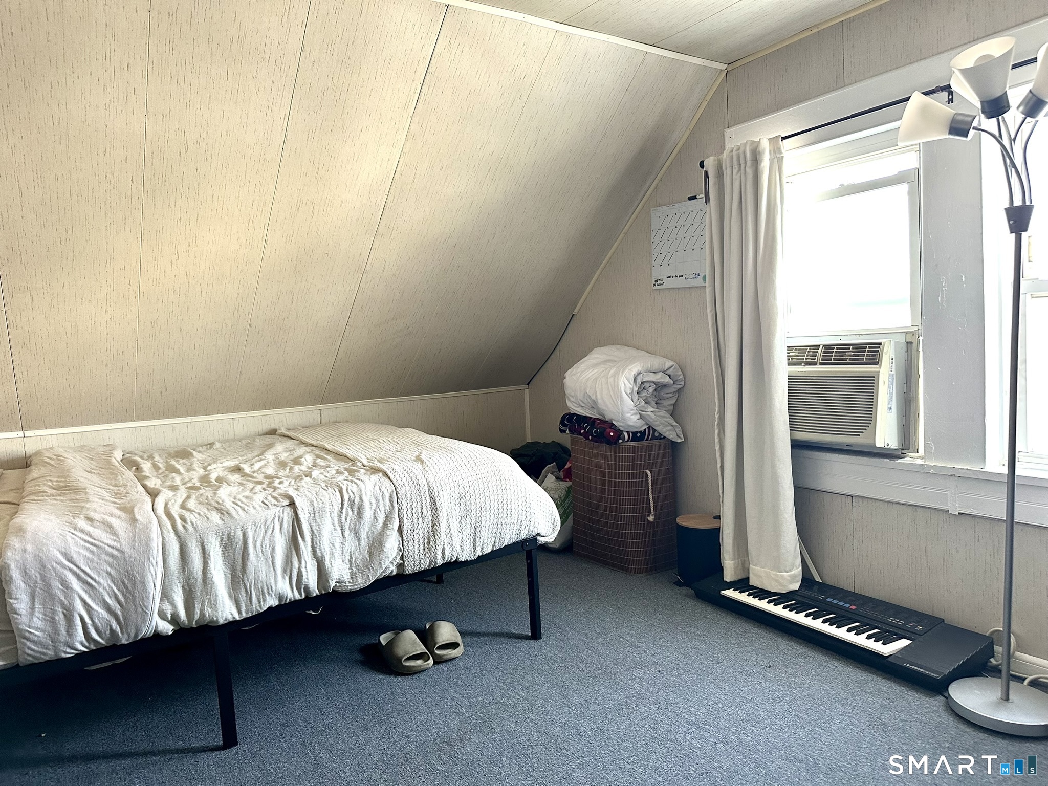 39 Pierce Street Fairfield, CT 06825 - Photo 14 of 18 a bedroom with a bed and a table