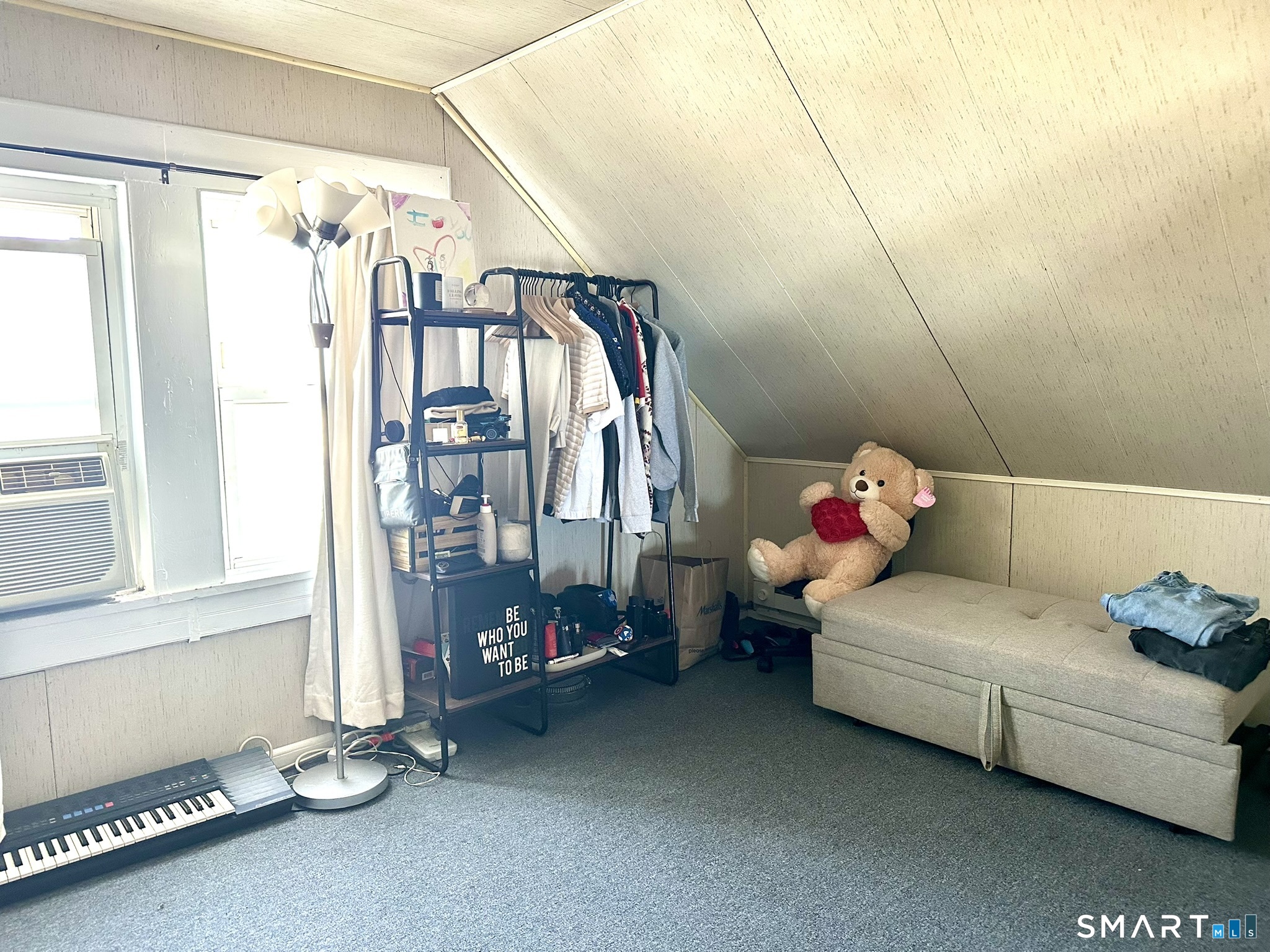 39 Pierce Street Fairfield, CT 06825 - Photo 15 of 18 a bedroom with a bed and a window