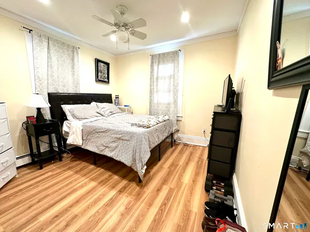 a bed room with a bed and a book shelf