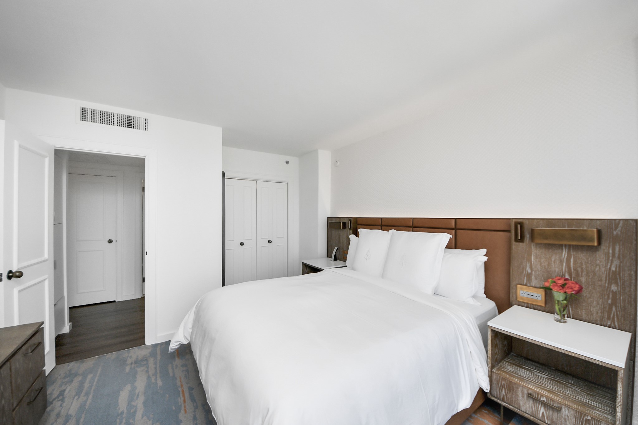 1300 Lamar Street, Unit T8 Houston, TX 77010 - Photo 21 of 48 a bedroom with a bed and wooden floor