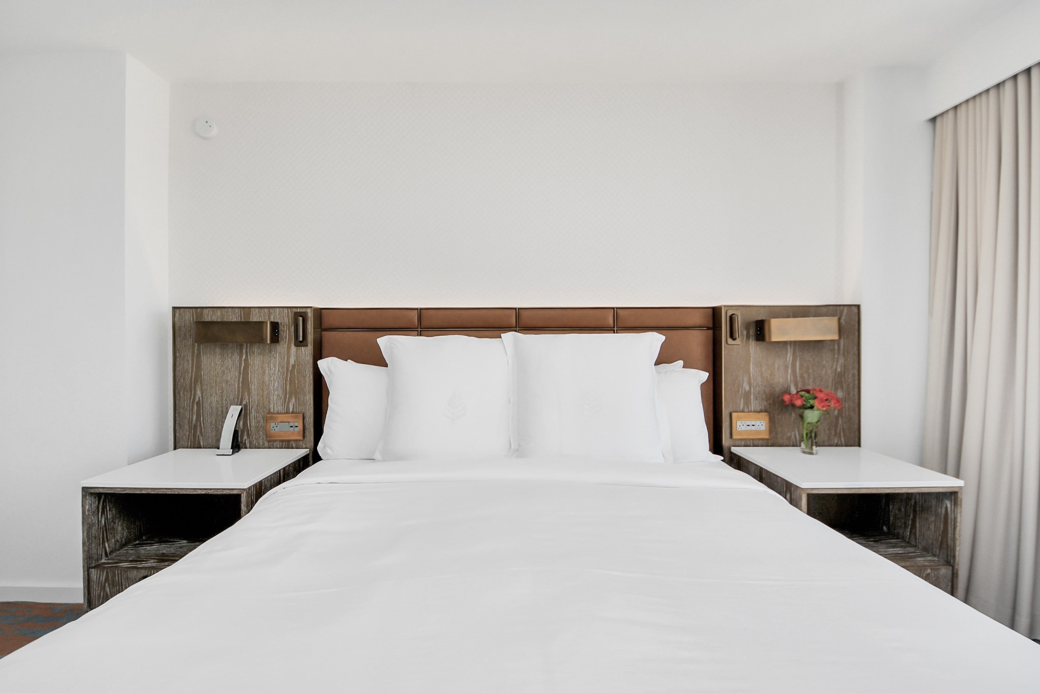 1300 Lamar Street, Unit T8 Houston, TX 77010 - Photo 22 of 48 a bed sitting in a bedroom and painting on the wall