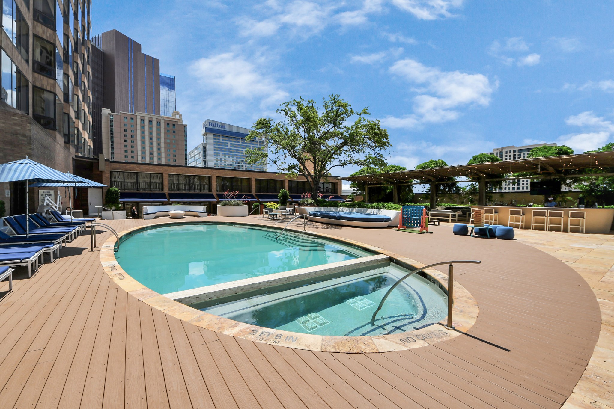 1300 Lamar Street, Unit T8 Houston, TX 77010 - Photo 43 of 48 a view of a swimming pool with a terrace
