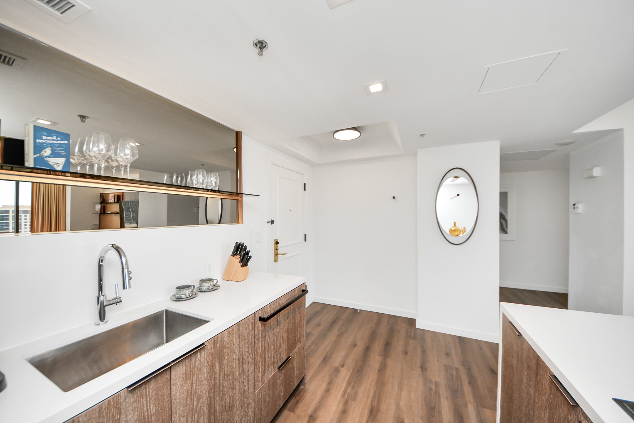 1300 Lamar Street, Unit T8 Houston, TX 77010 - Photo 8 of 48 a living room with stainless steel appliances kitchen island granite countertop a sink a stove and wooden floors