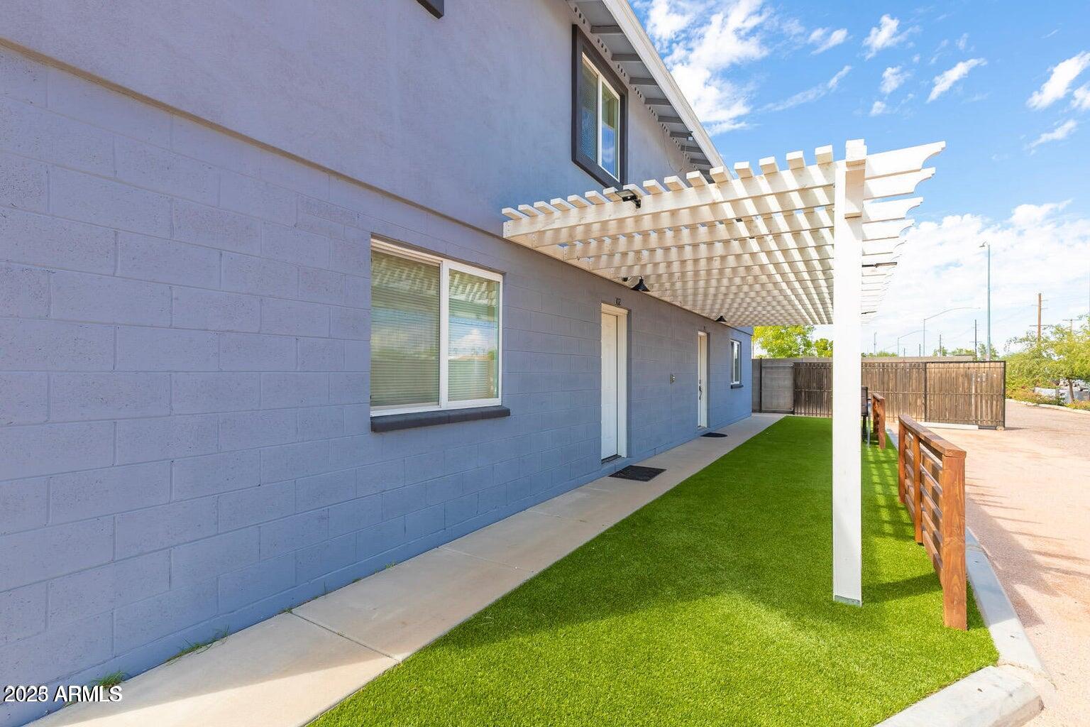 1161 East 5th Avenue, Unit 102 Mesa, AZ 85204 - Photo 1 of 9 a view of a backyard with a small cabin