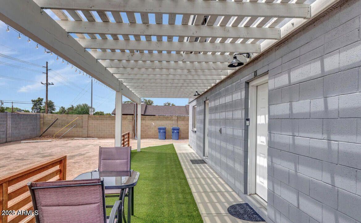 1161 East 5th Avenue, Unit 102 Mesa, AZ 85204 - Photo 9 of 9 a patio with table and chairs