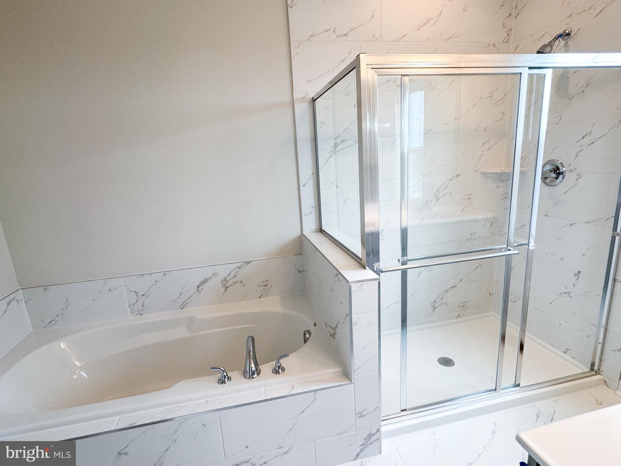 116 Flaxen Mane Court Stephenson, VA 22656 - Photo 14 of 28 a bathroom with a tub and shower