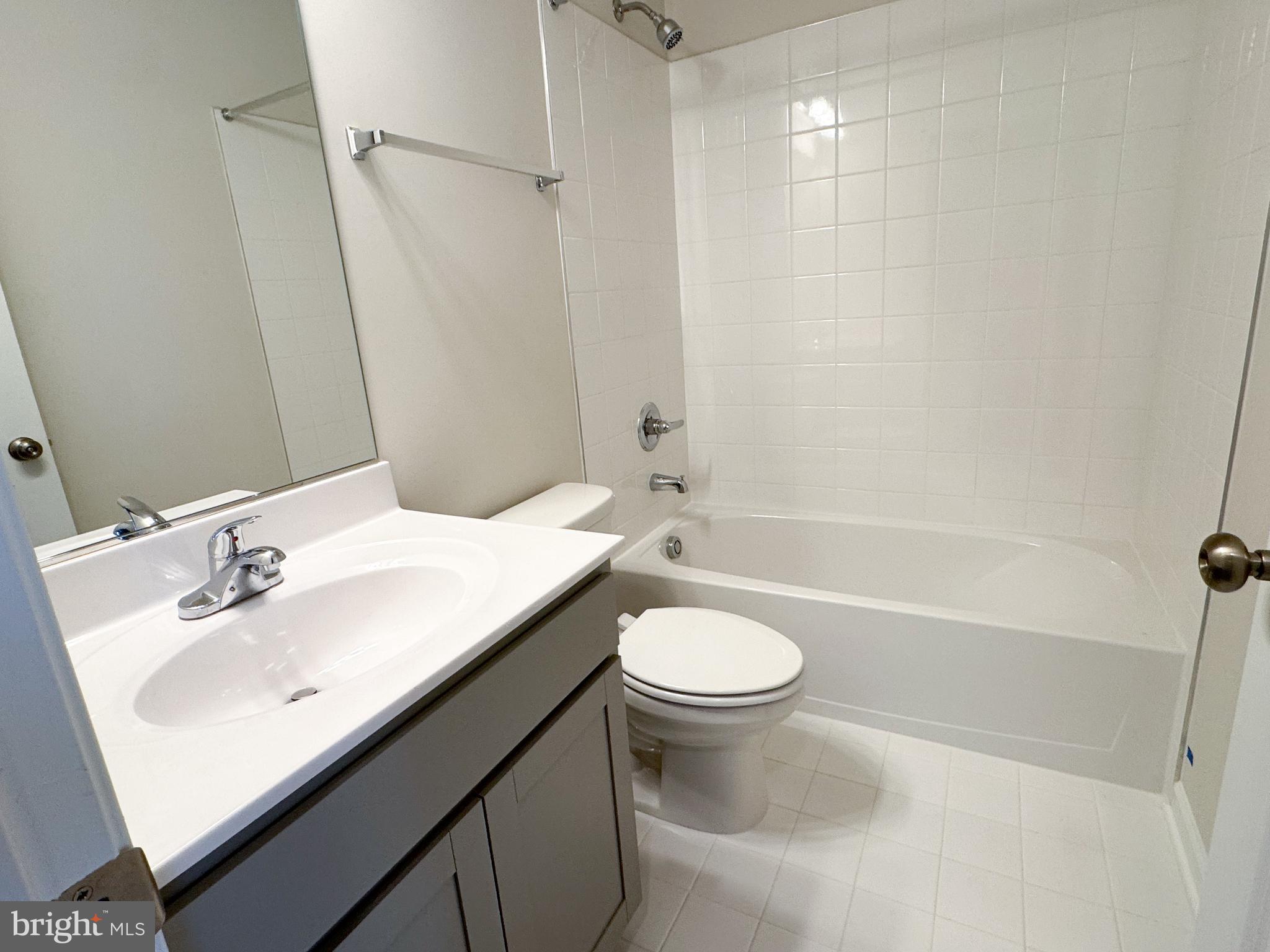 116 Flaxen Mane Court Stephenson, VA 22656 - Photo 18 of 28 a bathroom with a sink a toilet and a bathtub