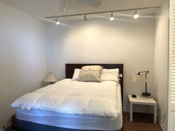 a large white bed in a small room