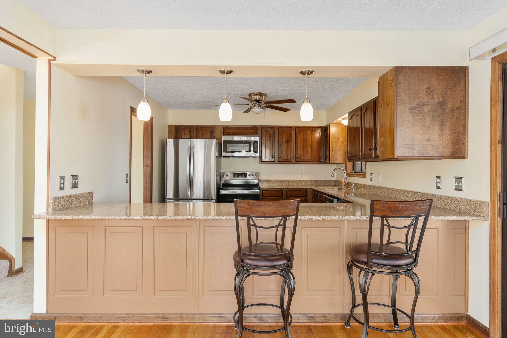 100 Pleasant Grove Road Locust Grove, VA 22508 - Photo 17 of 32 a view of a kitchen with dining area and windows