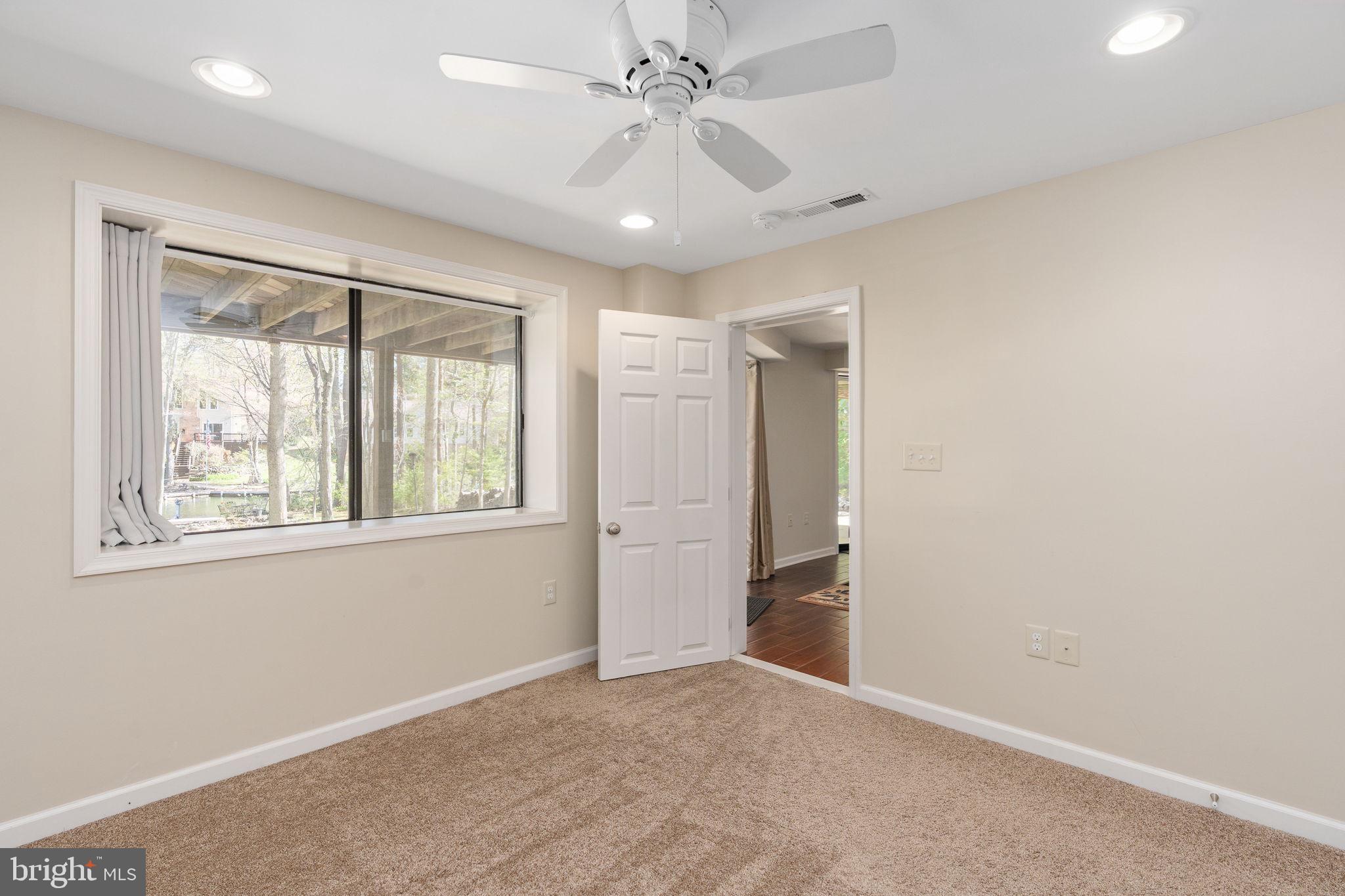 100 Pleasant Grove Road Locust Grove, VA 22508 - Photo 27 of 32 an empty room with windows and closet