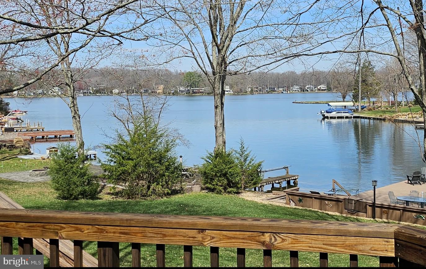 100 Pleasant Grove Road Locust Grove, VA 22508 - Photo 3 of 32 a view of a lake with houses in the back